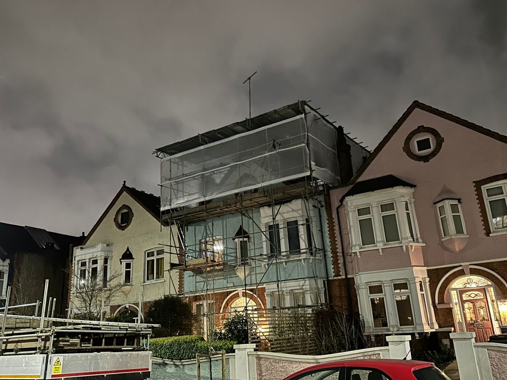 Temporary roof scaffolding hire protecting a residential property during roof works in London
